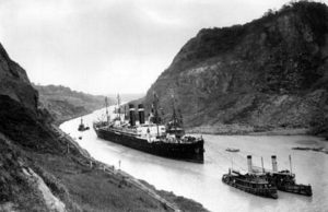 Panama Canal, SS Kroonland on 2 February 1915 at the Culebra Cut while transiting the Panama Canal.  Kroonland was the largest passenger ship to transit the canal up to that time, public domain image